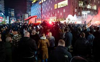 epa09592756 Hundreds of people gather during a protest against the 2G policy in Coolsingel, Rotterdam, Netherlands, 19 November 2021. Hundreds of demonstrators have gathered to protest against the tightened coronavirus measures.  EPA/Killian Lindenburg