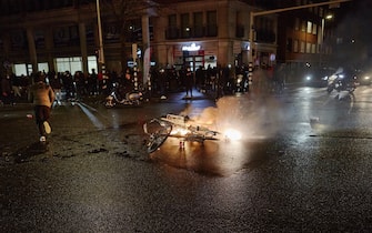 THE HAGUE, NETHERLANDS - NOVEMBER 20: Fireworks explode as riots erupt amid new Corona virus restrictions on November 20, 2021 in The Hague, Netherlands. (Photo by Pierre Crom/Getty Images)