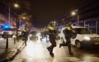 THE HAGUE, NETHERLANDS - NOVEMBER 20: Anti-riot forces clear the streets of The Hague as riots erupt amid new Corona virus restrictions on November 20, 2021 in The Hague, Netherlands. (Photo by Pierre Crom/Getty Images)