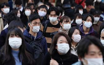 Shoppers wearing face masks walk through streets during the yearend shopping in preparation for the New Year in Tokyo, Japan, 26 December 2020. Tokyo marked highest record of 949 new infections of the Covid-19 Coronavirus per day, exceeding the previous highest record of 888 marked on 24 December. The COVID-19 infection cases in Japan has topped 200,000 on 21 December 2020.  ANSA/KIMIMASA MAYAMA
