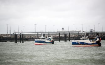 epa09604918 French fishing boats block the entrance of the Port of Calais starting a day of protests to mark anger over the issue of post-Brexit fishing licences, in Calais, France, 26 November 2021.  EPA/Mohammed Badra