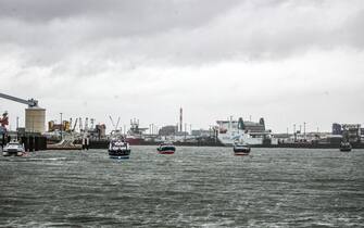 epa09605027 French fishing boats block the entrance of the Port of Calais starting a day of protests to mark anger over the issue of post-Brexit fishing licences, in Calais, France, 26 November 2021.  EPA/MOHAMMED BADRA