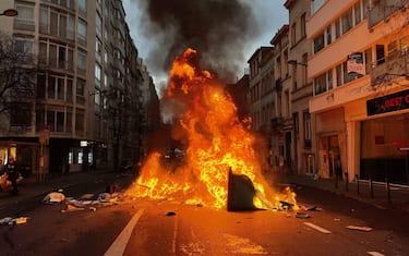 BRUSSELS, BELGIUM - DECEMBER 05: Demonstrators burn containers and things to block road as they gather for a protest named "Liberty Walk Act 2" against mandatory COVID-19 vaccine and other COVID-19 measures in Brussels, Belgium on December 05, 2021. (Photo by Dursun Aydemir/Anadolu Agency via Getty Images)