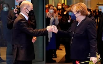 epa09629555 German Chancellor Olaf Scholz says goodbye to former German Chancellor Angela Merkel after the official handing over ceremony of the Chancellery in Berlin, Germany, 08 December 2021. A coalition of Social Democratic Party (SPD), Green party (Die Gruenen) and Free Democratic Party (FDP) forms the new German government.  EPA/CLEMENS BILAN