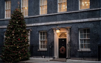 LONDON, ENGLAND - DECEMBER 08: A Christmas tree is displayed outside 10 Downing Street on December 8, 2021 in London, England. British Prime Minister Boris Johnson is facing accusations of lying after senior Downing Street officials were filmed joking about a lockdown Christmas party that they had previously insisted did not take place. Johnson will face questions in parliament later today at Prime Minister's Questions. (Photo by Chris J Ratcliffe/Getty Images)