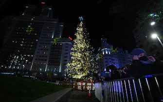 MADRID, SPAIN - NOVEMBER 26: The fir tree in Plaza España during the lighting of the city's Christmas lights on 26 November 2021, in Madrid, Spain. The Christmas lighting of the capital is inaugurated in the Plaza of Spain with the aim of adding in value this area of the city, after the reopening after its remodeling last November 22. A natural fir tree of 18 meters and 1.5 tons has been installed there, which has been decorated with 800 balls and 200 candles. (Photo By Fernando Sanchez/Europa Press via Getty Images)