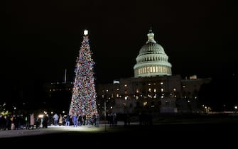 WASHINGTON, UNITED STATES - DECEMBER 1: Capitol Christmas tree lighting ceremony on the West Front Lawn of the U.S. Capitol in Washington, DC, United States on December 1, 2021. Nicknamed âSugar Bear,â  the 84-foot white fir comes from the Six Rivers National Forest in California. It is adorned with 15,000 ornaments made by the stateâs children. (Photo by Yasin Ozturk/Anadolu Agency via Getty Images)