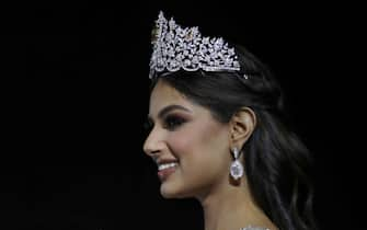 epa09639691 The new Miss Universe Harnaaz Sandhu of India gestures to the audience after being crowned at the Miss Universe 2021 pageant in Eilat, Israel, 13 December 2021. Contestants from 80 countries and territories have been selected to compete in the Miss Universe 2021 pageant, held in the Red Sea resort of Eilat, Israel.  EPA/ATEF SAFADI