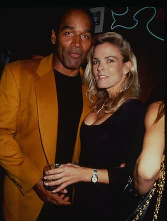 Portrait of American former foorball player OJ Simpson and his wife, Nicole Brown (1959 - 1994), as they attend a party at the Harley Davidson Cafe, New York, New York, 1993. Simpson was tried for the murder of his wife (on June 12, 1994) and, though he was acquitted in the murder trial, he was found guilty of wrongful death in a subsequent civil suit--still later, he was found guilty of other felony charges (unrelated to the murder) and convicted in 2008. (Photo by Rose Hartman/Getty Images)
