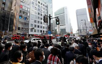Crowd in front of the building where the fire occurred in Osaka