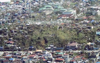 epa09647613 A handout picture made available by the Philippine Coast Guard (PCG) shows an aerial view of a typhoon affected village in Surigao City, southern Philippines, 17 December 2021 (issued on 18 December 2021). According to the National Disaster Risk Reduction and Management Council (NDRRMC), the death toll from the strongest typhoon to hit the Philippines this year has risen to 18 and more than 300,000 people were evacuated from their homes and beachfront resorts, as Typhoon Rai ravaged the central region of the country.  EPA/PCG / HO HANDOUT BEST QUALITY AVAILABLE HANDOUT EDITORIAL USE ONLY/NO SALES