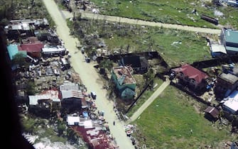epa09647611 A handout picture made available by the Philippine Coast Guard (PCG) shows an aerial view of a typhoon affected village in Surigao City, southern Philippines, 17 December 2021 (issued on 18 December 2021). According to the National Disaster Risk Reduction and Management Council (NDRRMC), the death toll from the strongest typhoon to hit the Philippines this year has risen to 18 and more than 300,000 people were evacuated from their homes and beachfront resorts, as Typhoon Rai ravaged the central region of the country.  EPA/PCG / HO HANDOUT BEST QUALITY AVAILABLE HANDOUT EDITORIAL USE ONLY/NO SALES