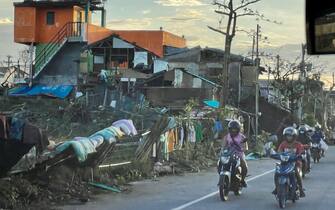 epa09648242 A handout photo made available by the Office of the Vice President (OVP) shows motorists maneuvering next to damaged houses in the typhoon devastated city of Cebu, Philippines, 18 December 2021. According to the National Disaster Risk Reduction and Management Council (NDRRMC),? the death toll from the strongest typhoon to hit the Philippines this year has risen to 31 and more than 300,000 people were evacuated from their hom?es and beachfront resorts, as Typhoon Rai ravaged the central region of the country.  EPA/HANDOUT  HANDOUT EDITORIAL USE ONLY/NO SALES