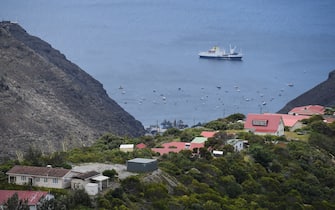 JAMESTOWN, SAINT HELENA - OCTOBER 27:  The RMS "St Helena" sails in the harbour on October 26, 2017 in Jamestown, Saint Helena. Following the introduction of weekly flights to the island, resident St Helenians, known locally as "Saints", are preparing for a potential influx of tourists and investment as well as enjoying the possibilities brought by much faster transport links with South Africa. Previously, travel to the island involved travelling for a week by the Royal Mail Ship (RMS) "Saint Helena" from Cape Town. Saint Helena is a 46 square mile island in the South Atlantic which has been under British control since 1834.  (Photo by Leon Neal/Getty Images)