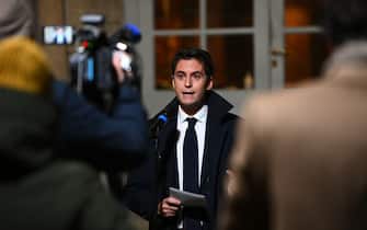France's Secretary of State and Government's spokesperson Gabriel Attal talks to media following a meeting of France's Prime Minister with associations of local elected representatives and the Parliamentary Liaison Committees in Paris on December 21, 2021. (Photo by Christophe ARCHAMBAULT / AFP) (Photo by CHRISTOPHE ARCHAMBAULT/AFP via Getty Images)