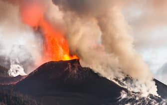LA PALMA CANARY ISLANDS, SPAIN - NOVEMBER 19: Cumbre Vieja volcano, on 19 November, 2021 in La Palma, Santa Cruz de Tenerife, Canary Islands, Spain. The volcano currently has three active fronts, one that runs from Montaña Rajada to the north of Montaña Cogote -colada 11--, another that continues to feed the lava deltas and the third, the most intense one, which runs between lava flows 4 and 7. At a press conference, the deputy director of Pevolca, Ruben Fernandez, and the volcanologist of the IGN, Carmen Lopez, said it is occupying new space at the expense of homes and farms but has slowed and is advancing at about 20 meters per hour. In addition, it has also stopped the overflow of the main cone that was detected on Thursday night and caused an increase in the rate of emission of lava, very fluid, and the growth of its flow. (Photo By Europa Press via Getty Images)
