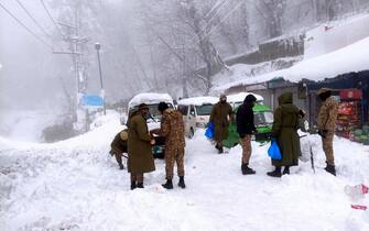 Rescuers at work in Pakistan after the snowstorm
