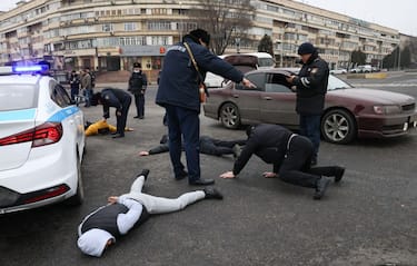 ALMATY, KAZAKHSTAN  JANUARY 10, 2022: Police officers detain violators in a street. Kazakhstan has been gripped by unrest since 2 January 2022 sparked by a rise in the price for liquefied petroleum gas used for vehicles. On January 5, 2022, Kazakhstan's President Tokayev dismissed the cabinet, declared a two-week state of emergency over mass unrest in the country and asked the Collective Security Treaty Organisation (CSTO) for assistance. On January 6, 2022, a counterterrorism operation to stop mass unrest began in Almaty. Valery Sharifulin/TASS (Photo by Valery Sharifulin\TASS via Getty Images)