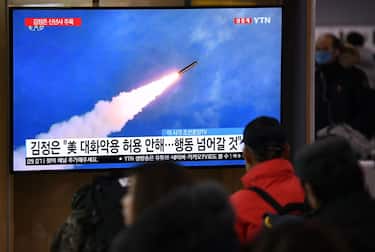 People watch a television news programme showing file footage of North Korea's missile test, at a railway station in Seoul on January 1, 2020. - North Korean leader Kim Jong Un has declared an end to its moratoriums on nuclear and intercontinental ballistic missile tests and threatened a demonstration of a "new strategic weapon" soon. (Photo by Jung Yeon-je / AFP) (Photo by JUNG YEON-JE/AFP via Getty Images)