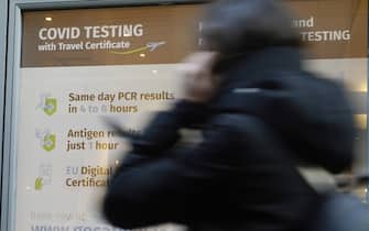People pass a Covid-19 testing centre in Dublin city centre as the Government is to consider plans to relax the rules around close contacts, following public health advice. Picture date: Wednesday January 12, 2022. (Photo by Niall Carson/PA Images via Getty Images)