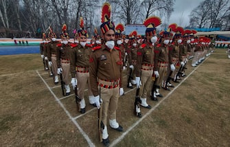 SRINAGAR, KASHMIR, INDIA-JANUARY 26: Indian policeman wear protective face masks as they take part in the parade during the official celebration for India's Republic Day at Sher-i-Kashmir Stadium in Srinagar, Kashmir on January 26, 2022. (Photo by Faisal Khan/Anadolu Agency via Getty Images)