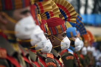 SRINAGAR, KASHMIR, INDIA-JANUARY 26: An Indian soldier wears a protective face mask as he takes part in the parade during the official celebration for India's Republic Day at Sher-i-Kashmir Stadium in Srinagar, Kashmir on January 26, 2022. (Photo by Faisal Khan/Anadolu Agency via Getty Images)