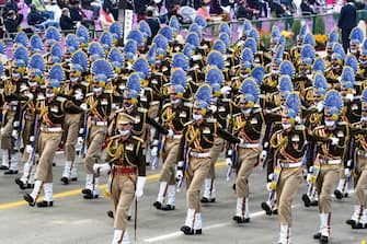 NEW DELHI, INDIA - JANUARY 26, 2022 : A Central Industrial Security Force contingent marches contingent marches during India's 73rd Republic Day parades in New Delhi on India ,January 26, 2022. (Photo by Stringer/Anadolu Agency via Getty Images)
