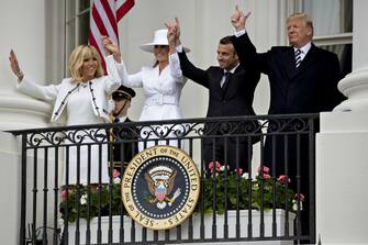 FILE: U.S. President Donald Trump, from right, Emmanuel Macron, France's president, U.S. First Lady Melania Trump, and Brigitte Macron, France's first lady, wave on the Truman Balcony of the White House at an arrival ceremony during a state visit in Washington, D.C., U.S., on Tuesday, April 24, 2018. Monday, January 20, 2020, marks the third anniversary of U.S. President Donald Trump's inauguration. Our editors select the best archive images looking back over Trumps term in office. Photographer: Andrew Harrer/Bloomberg via Getty Images