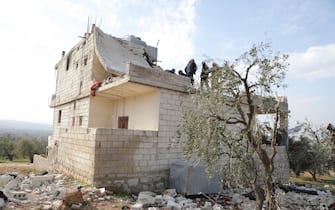 epa09724947 A damaged house is seen after an alleged counterterrorism operation by US Special forces in the early morning in Atma village in the northern countryside of Idlib, Syria, 03 February 2022. President Joe Biden said on 03 February that a U.S. raid in Syria killed Abu Ibrahim al-Hashimi al-Qurayshi - the leader of ISIS. The Britain-based Syrian Observatory for Human Rights reported that there were 'confirmed reports of fatalities', but did not provide numbers or identities.  EPA/YAHYA NEMAH