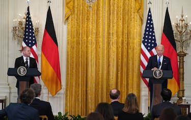 Olaf Scholz, Germany's chancellor, left, and U.S. President Joe Biden during a news conference in the East Room of the White House in Washington, D.C., U.S., on Monday, Feb. 7 2022. Biden met with Scholz to discuss the situation with Ukraine amid questions over Germany's resolve to stand firm against Russia. Photographer: Leigh Vogel/UPI/Bloomberg