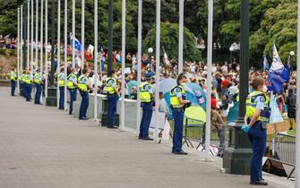 1238337444 WELLINGTON, NEW ZEALAND - FEBRUARY 10: Hundreds of people gather outside Parliament to protest against the mandatory COVID-19 vaccination for the third day, Wellington, New Zealand on February 10, 2022. Three people were arrested on Wednesday as nearly 100 protesters camped overnight on Parliament grounds. (Photo by Mike Clare/Anadolu Agency via Getty Images)