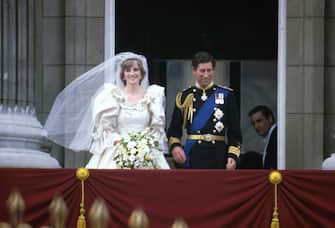 Prince Charles & Princess Diana (1961 - 1997) stand on the balcony of Buckingham Palace after their wedding ceremony at St. Paul's Cathedral, London, England, July 29, 1981. (Photo by Express Newspapers/Getty Images) 