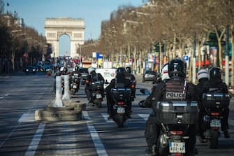 epa09749461 Members of the Brav-M patrol ride along the Champs Elysee as a 'Freedom Convoy' protest was expected in Paris, France, 12 February 2022. Paris police have prohibited the convoy, as announced by the capital's prefect on 10 February. A series of convoy demonstrations has been taking place in France to call for the lifting of all Covid-19-related restrictions and mandates, in light of the ongoing protest in Canada, where truck drivers have been rallying against the government-imposed mandatory Covid-19 vaccine to enter the country.  EPA/CHRISTOPHE PETIT TESSON