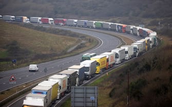 Haulage trucks queue on the A20 road as part of operation Traffic Assessment Project (TAP) on the approach to the Port of Dover Ltd. in Dover, UK, on ​​Tuesday, Jan. 25, 2022. The European Unions Brexit negotiator said talks with the UK could prompt a timely resolution depending on political goodwill, but offered no evidence of a breakthrough after the latest round with Foreign SecretaryÂ Liz Truss.  Photographer: Chris Ratcliffe / Bloomberg via Getty Images