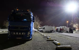 GRIMBERGEN, BELGIUM - FEBRUARY 13: Participants of the "Freedom Convoy" (Convoi de la Liberte -  vrijheidskonvooi) prepare themselves to pass the night in the Heyzel ' parking lot on February 13, 2022 in Grimbergen, Belgium. People plan to demonstrate in the street of Brussels on February 14th. The 'Freedom Convoy' movement was originally against the mandatory anti-COVID-19 vaccination to enter Canada by land, introduced on January 15th by the Canadian government. (Photo by Thierry Monasse/Getty Images)