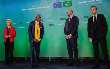 epa09770132 Ugandan Foreign Minister Jeje Odongo (2-L) is welcomed by European Commission President Ursula von der Leyen (R), European Council President Charles Michel (2-R) and French President Emmanuel Macron (R), during the sixth European Union - African Union summit in Brussels, Belgium, 18 February 2022. The leaders of the African Union (AU) join EU leaders for a two-day summit in Brussels. Ahead of the summit, EU heads of state or government will gather for an informal meeting of the members of the European Council to discuss the state of play of the latest developments related to Russia and Ukraine.  EPA/OLIVIER HOSLET / POOL