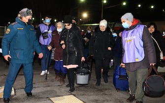 VOLZHSKY, VOLGOGRAD REGION, RUSSIA - FEBRUARY 20, 2022: People evacuated from the Donetsk and Lugansk People's Republic are seen at a railway station. Amid the escalating conflict in east Ukraine, on February 18, 2022, the heads of the Lugansk and Donetsk People's Republics announced a mass evacuation of civilians to Russia. The first train carrying 400 evacuated Donbass residents has arrived in the town of Volzhsky from Russia's Rostov-on-Don Region. Dmitry Rogulin/TASS (Photo by Dmitry Rogulin\TASS via Getty Images)