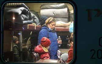 VOLZHSKY, VOLGOGRAD REGION, RUSSIA - FEBRUARY 20, 2022: People evacuated from the Donetsk and Lugansk People's Republic are seen on a train at a railway station. Amid the escalating conflict in east Ukraine, on February 18, 2022, the heads of the Lugansk and Donetsk People's Republics announced a mass evacuation of civilians to Russia. The first train carrying 400 evacuated Donbass residents has arrived in the town of Volzhsky from Russia's Rostov-on-Don Region. Dmitry Rogulin/TASS

EDITORIAL USE ONLY. NO COMMERCIAL USE. NO ADVERTISING (Photo by Dmitry Rogulin\TASS via Getty Images)