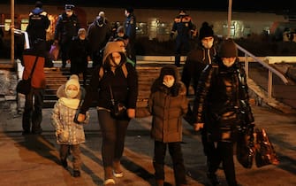 VOLZHSKY, VOLGOGRAD REGION, RUSSIA - FEBRUARY 20, 2022: People evacuated from the Donetsk and Lugansk People's Republics are seen at a railway station. Amid the escalating conflict in east Ukraine, on February 18, 2022, the heads of the Lugansk and Donetsk People's Republics announced a mass evacuation of civilians to Russia. The first train carrying 400 evacuated Donbass residents has arrived in the town of Volzhsky from Russia's Rostov-on-Don Region. Dmitry Rogulin/TASS

EDITORIAL USE ONLY. NO COMMERCIAL USE. NO ADVERTISING (Photo by Dmitry Rogulin\TASS via Getty Images)