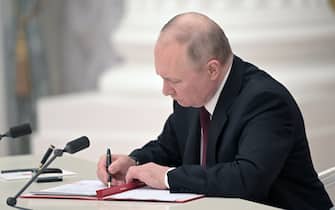 MOSCOW, RUSSIA - FEBRUARY 21, 2022: Russia's President Vladimir Putin signs decrees to recognize independence of the Donetsk and Lugansk People's Republics. Alexei Nikolsky/Russian Presidential Press and Information Office/TASS/Sipa USA