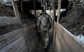 A soldier of the Armed Forces of Ukraine in the trenches near Verkhnetoretske, Ukraine, on November 11, 2021. (Photo by Alfons Cabrera / Sipa USA)