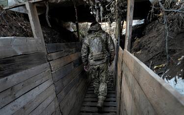 A soldier of the Armed Forces of Ukraine in the trenches near Verkhnetoretske, Ukraine, on November 11, 2021. (Photo by Alfons Cabrera/Sipa USA)
