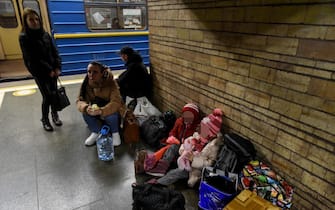 epa09781224 Ukrainians take shelter in a metro station after air raid sirens alarm in Kiev, Ukraine, 24 February 2022. Russian troops launched a major military operation on Ukraine on 24 February, after weeks of intense diplomacy and the imposition of Western sanctions on Russia aimed at preventing an armed conflict in Ukraine. Martial law has been introduced in Ukraine, explosions are heard in many cities, including Kiev.  EPA/STRINGER