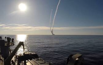 RUSSIA - MAY 23, 2018: Pictured in this screen grab are Bulava missile (in the distance) launched by the Russian Navy Northern Fleet's Project 955 Borei nuclear missile cruiser submarine Yuri Dolgoruky from a submersed position from the White Sea in north-west Russia at the Kura testing grounds on Kamchatka Peninsula on Russia's Pacific coast during a military drill. Screen grab/Ministry of Defence of the Russian Federation/TASS (Photo by TASS\TASS via Getty Images)