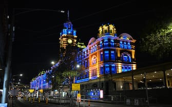 MELBOURNE, AUSTRALIA - FEBRUARY 24: The flag colors of Ukraine are projected on the Flinders Train Station in order to show solidarity with Ukraine in Melbourne, Australia on February 24, 2022. Also the Federation Square and some bridges were illuminated with the yellow and blue colors of the Ukrainian flag to support Ukraine. (Photo by Recep Sakar/Anadolu Agency via Getty Images)