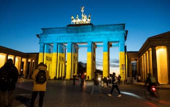 dpatop - 23 February 2022, Berlin: The Brandenburg Gate is illuminated in the colors of the Ukrainian flag. Photo: Christophe Gateau/dpa (Photo by Christophe Gateau/picture alliance via Getty Images)