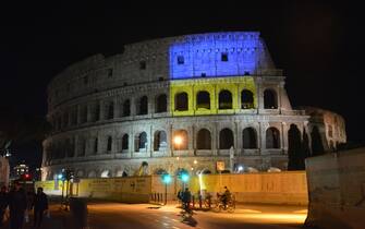ROME, ITALY - FEBRUARY 24: Colosseum illuminated with the color of Ukrainian flag in solidarity with Ukrainian people after Russia's attack in Ukraine, in Rome, Italy on February 24, 2022. (Photo by Baris Seckin/Anadolu Agency via Getty Images)
