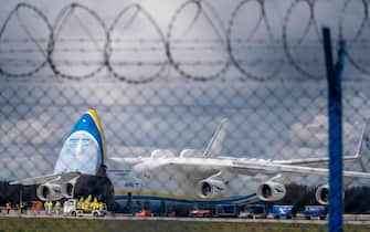 Workers arrive to unload an Ukrainian Antonov-225 Mriya aircraft which arrived from China loaded with medical equipment needed against the novel coronavirus at the International Warsaw Chopin Airport on April 14, 2020. (Photo by Wojtek RADWANSKI / AFP) (Photo by WOJTEK RADWANSKI/AFP via Getty Images)