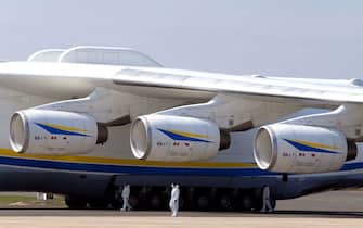 This picture shows the wing and three of the six turbofans of the Ukrainian Antonov An-225 Mriya coming from China to deliver 8,6 million face masks and 150 tons of sanitary equipment ordered by a private customer, at the Paris-Vatry airport in Bussy Lettree, on April 19, 2020, on the 34th day of a strict lockdown in France to stop the spread of COVID-19 (novel coronavirus).  - The Antonov-225 is a cargo plane designed as part of the former Soviet Union's space program.  The only copy in use can carry up to 250 tonnes up to 4,000 km.  (Photo by FRANCOIS NASCIMBENI / AFP) (Photo by FRANCOIS NASCIMBENI / AFP via Getty Images)