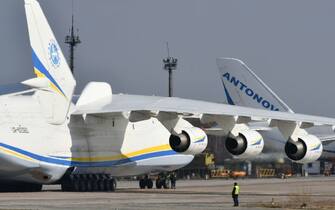 The worlds largest aircraft, the Antonov An-225 Mriya cargo aeroplane (L), prepares to take off from the Antonov plant's airdrome in Gostomel, some 30 kilometres from Kiev on April 3, 2018. 

The aircraft is heading to the German city of Leipzig from where it will conduct its first commercial flight following checks.
 / AFP PHOTO / GENYA SAVILOV        (Photo credit should read GENYA SAVILOV/AFP via Getty Images)